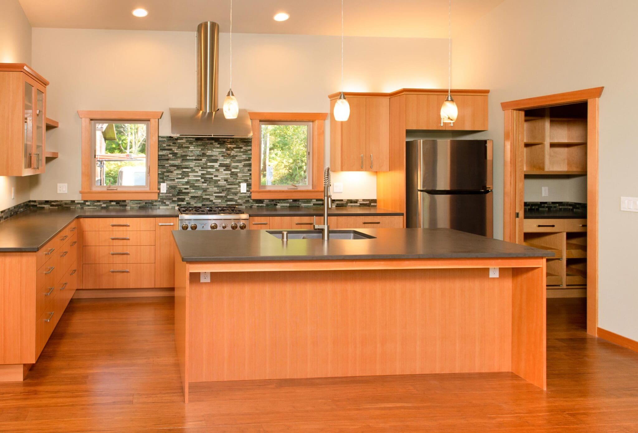 Kitchen - Wood Wrap - Cabinetry - Matte Quartz - Glass Tile Backsplash - Engineered Bamboo Floor